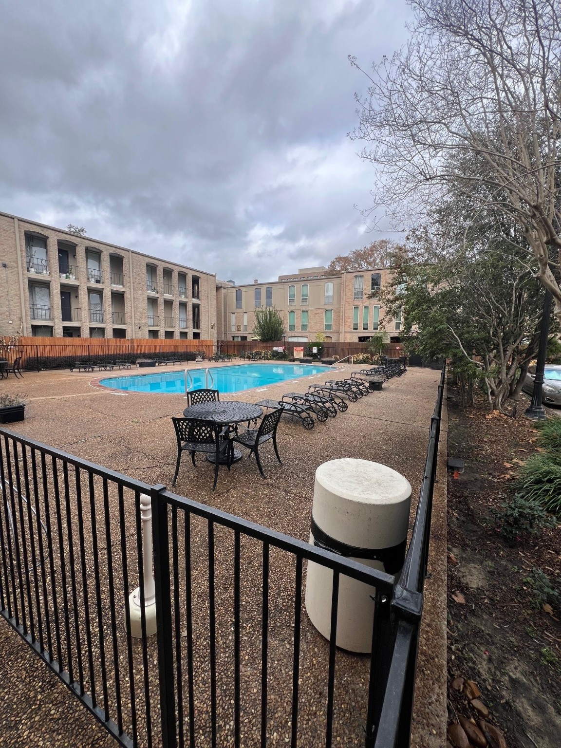 4631 Wild Indigo Street, Unit 572 Houston, TX 77027 - Photo 2 of 13 a balcony with table and chairs