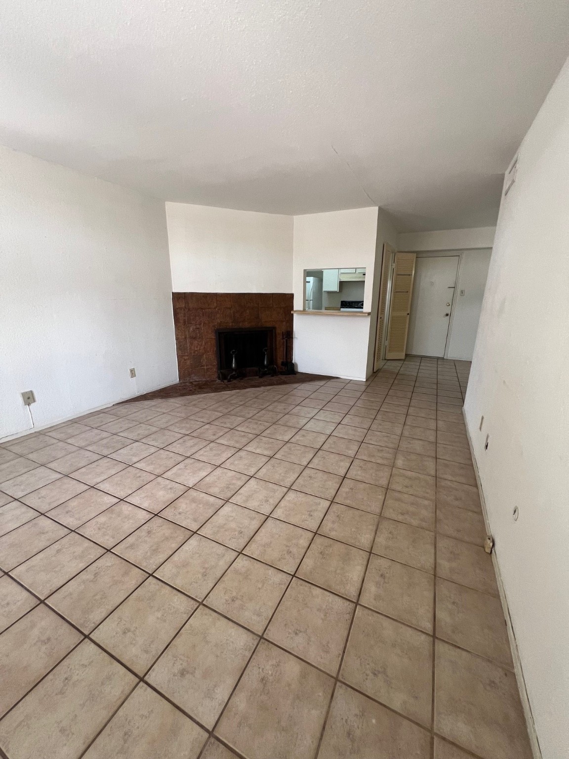 4631 Wild Indigo Street, Unit 572 Houston, TX 77027 - Photo 7 of 13 a view of a livingroom with a fireplace