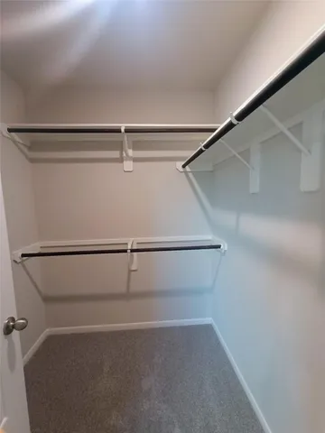 a view of an empty walk in closet
