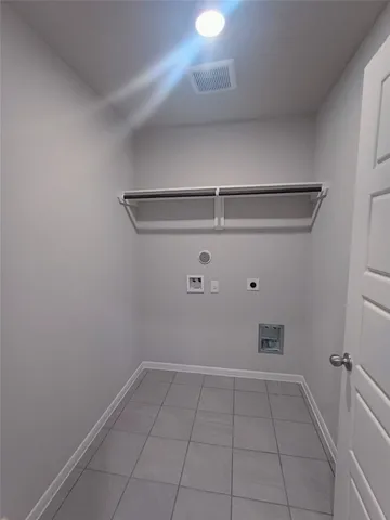 a view of a storage & utility room with racks on the wall