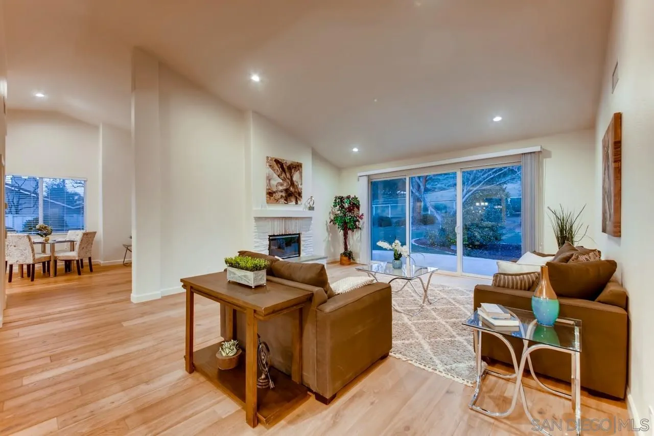15825 Bent Tree Road Poway, CA 92064 - Photo 5 of 38 a living room with fireplace furniture and a wooden floor