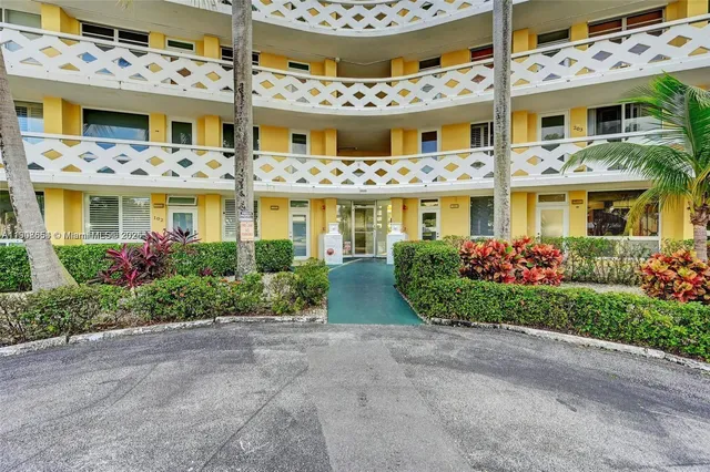 an aerial view of a house with outdoor space and street view