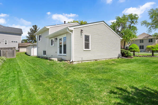-n148 Silverleaf Boulevard Wheaton, IL 60187 - Photo 23 of 25 a front view of house with yard and green space