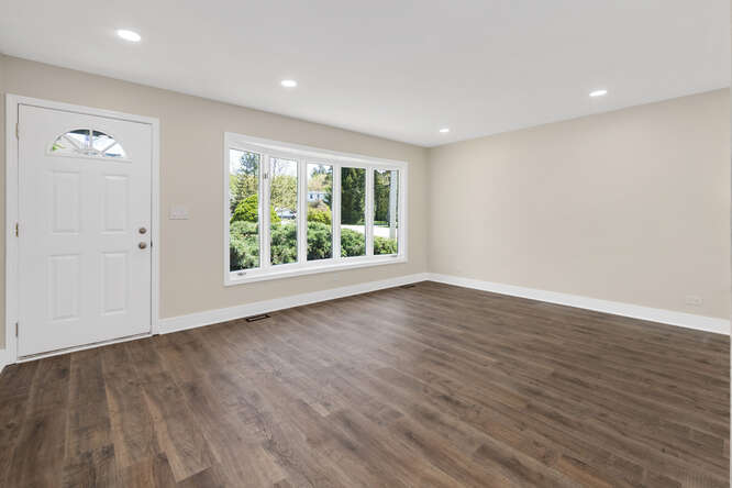 -n148 Silverleaf Boulevard Wheaton, IL 60187 - Photo 5 of 25 a view of an empty room with wooden floor and a window