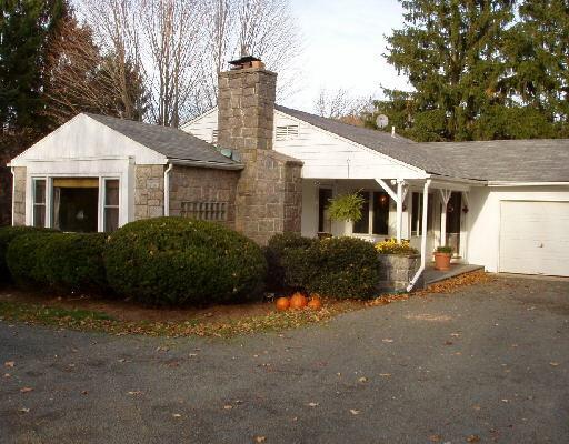 213 Clapboard Ridge Road Danbury, CT 06811 - Photo 1 of 1 a front view of a house with a garden
