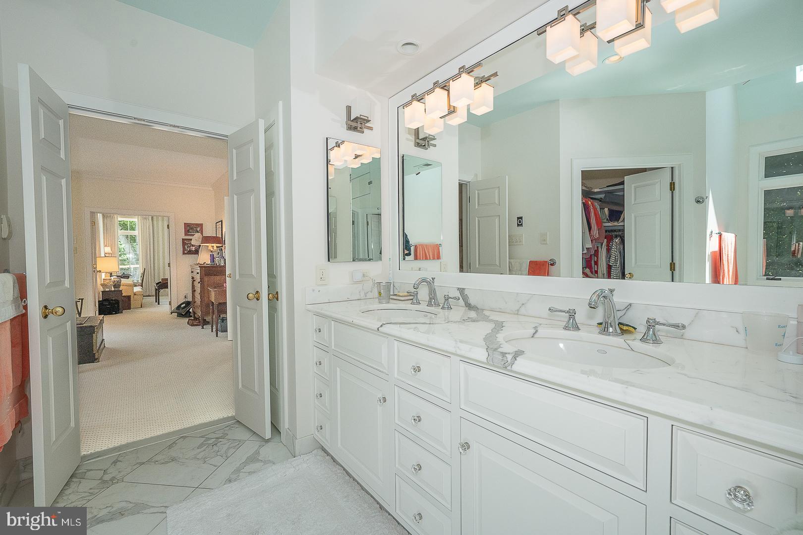 1241 Denbigh Lane Wayne, PA 19087 - Photo 21 of 94 a en suite bathroom with double sink and a mirror