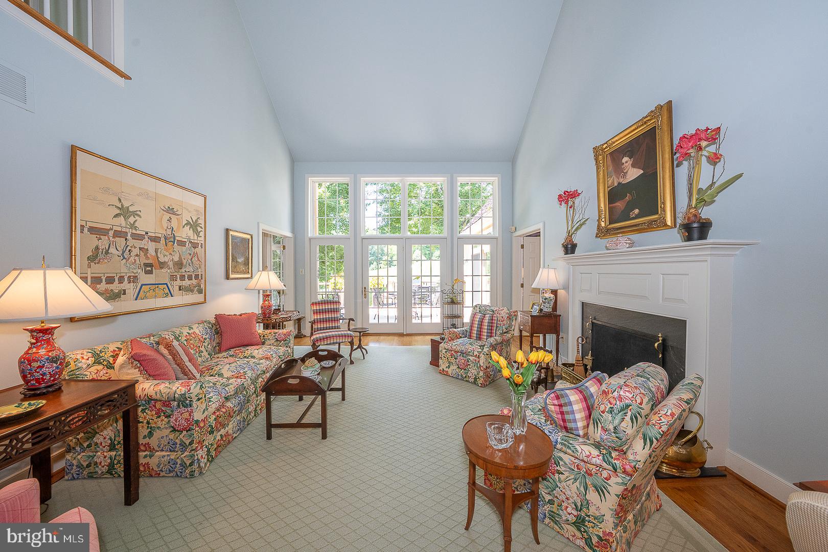 1241 Denbigh Lane Wayne, PA 19087 - Photo 29 of 94 a living room with furniture a fireplace and a large window