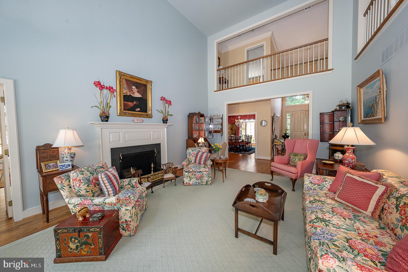 1241 Denbigh Lane Wayne, PA 19087 - Photo 30 of 94 a living room with furniture a fireplace and a flat screen tv
