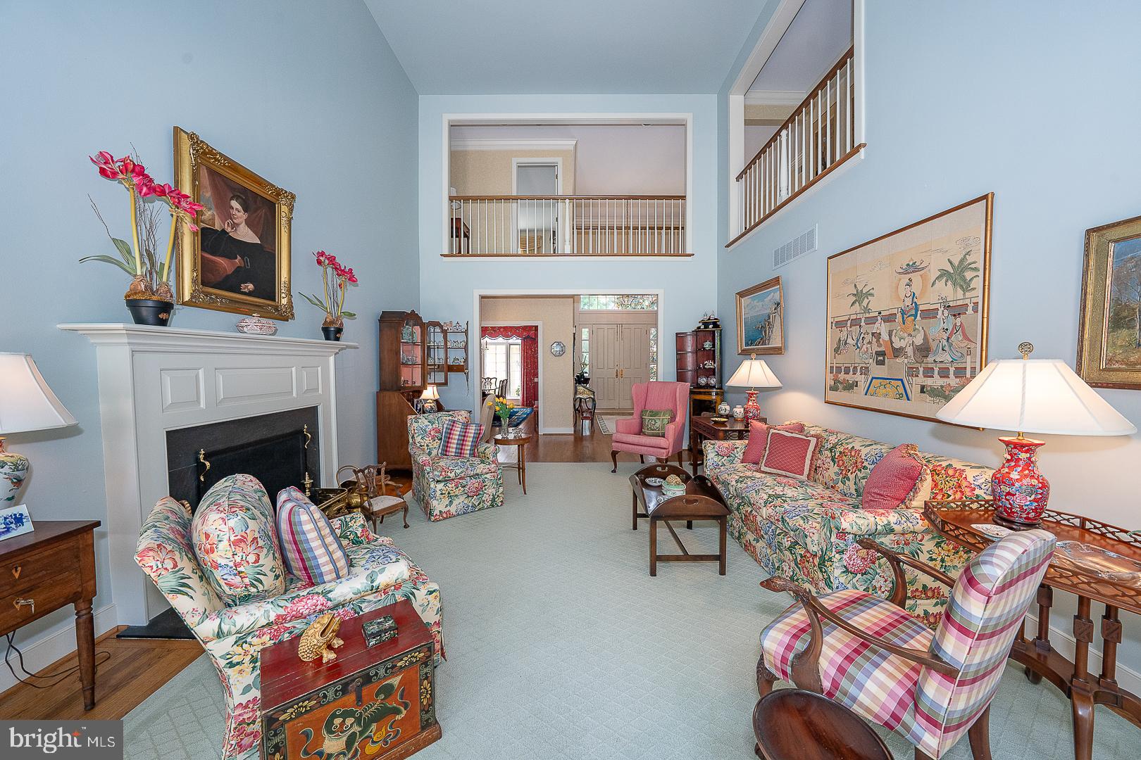 1241 Denbigh Lane Wayne, PA 19087 - Photo 31 of 94 a living room with furniture a fireplace and a flat screen tv