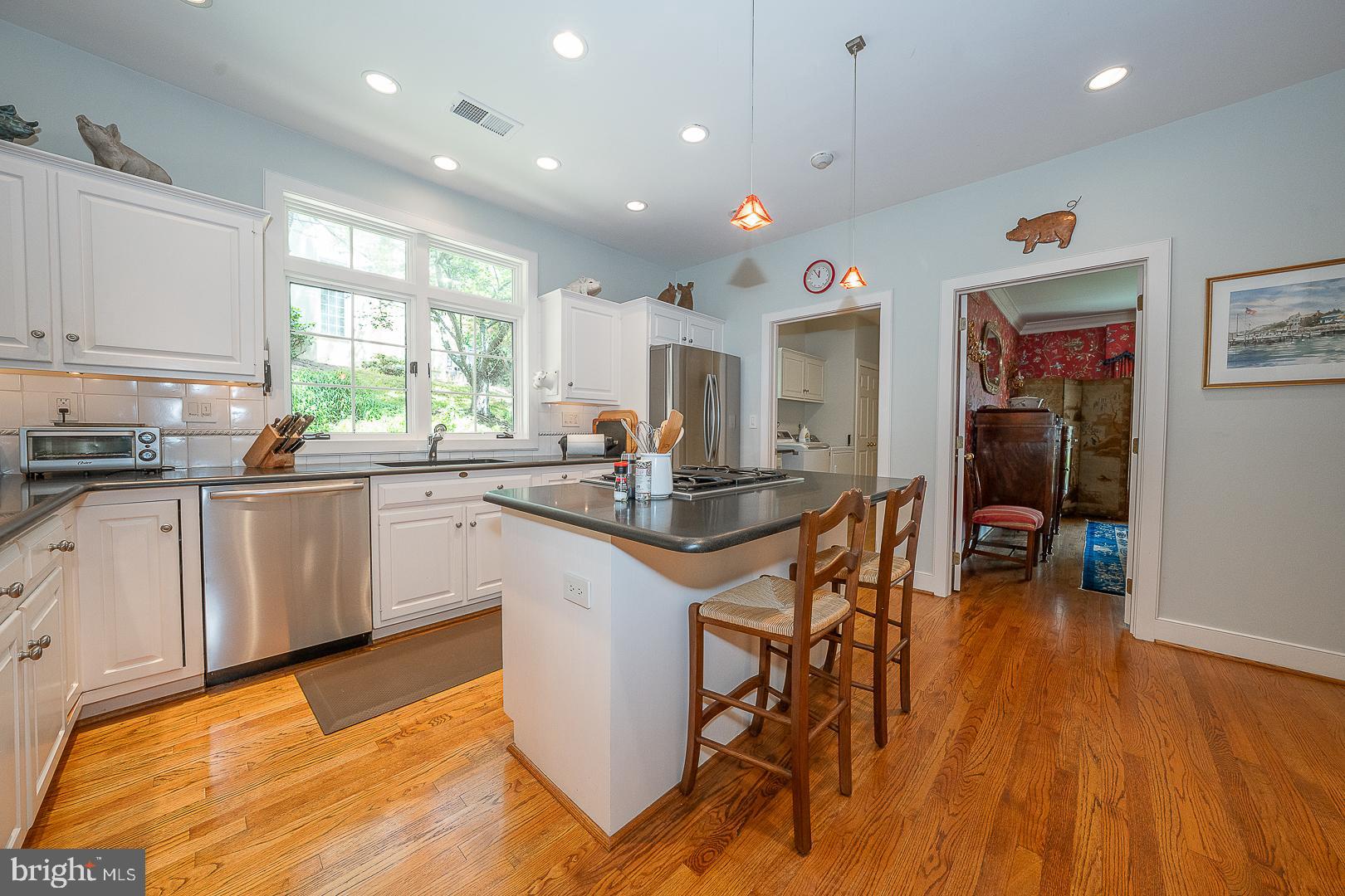 1241 Denbigh Lane Wayne, PA 19087 - Photo 38 of 94 a kitchen with stainless steel appliances granite countertop a sink counter space and a dining table