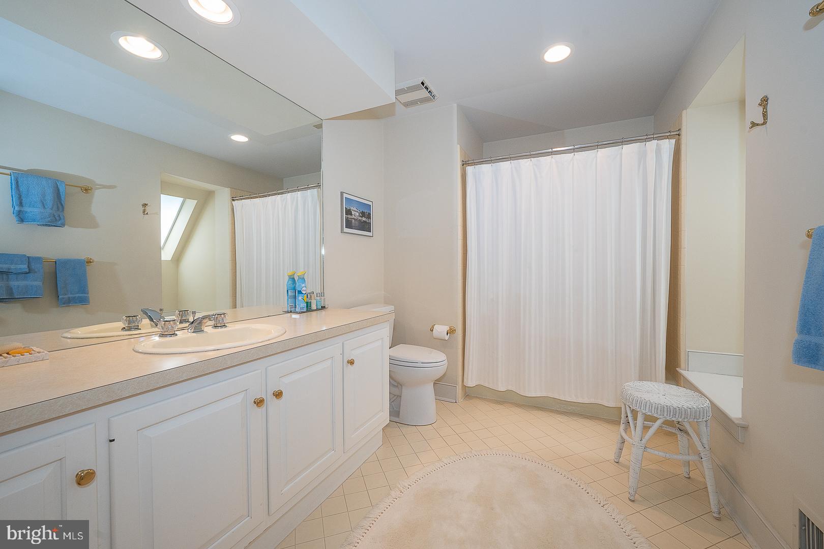 1241 Denbigh Lane Wayne, PA 19087 - Photo 61 of 94 a bathroom with a granite countertop sink a toilet and a mirror