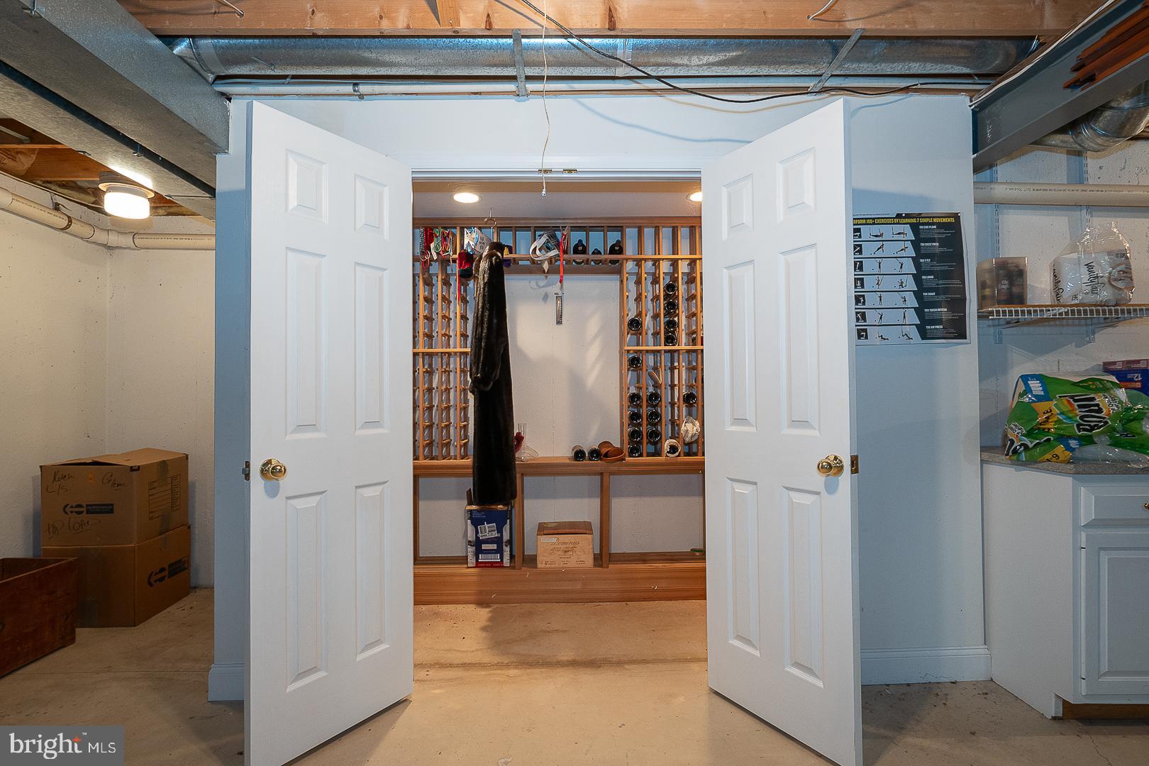 1241 Denbigh Lane Wayne, PA 19087 - Photo 66 of 94 a view of a hallway with wooden shelves