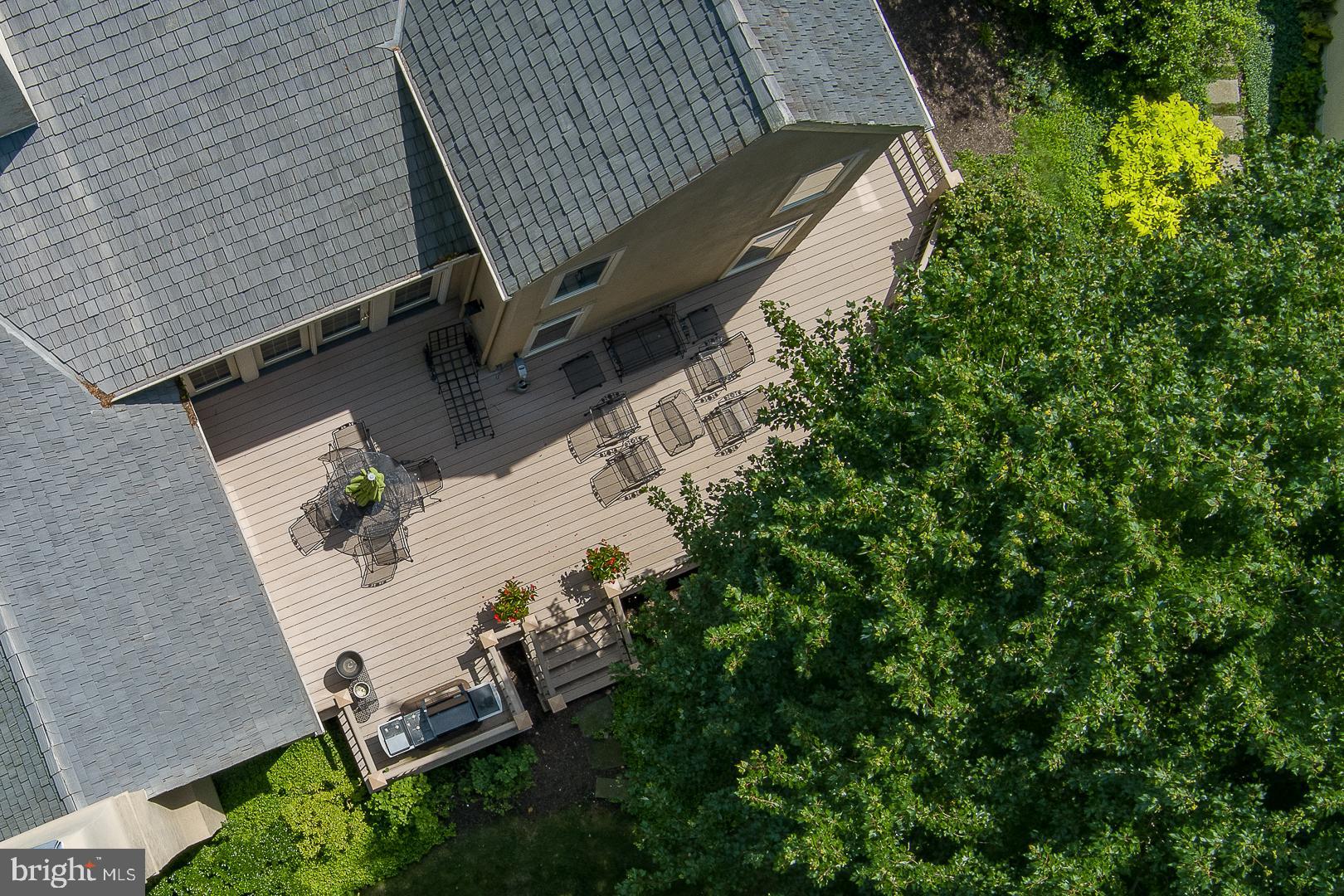 1241 Denbigh Lane Wayne, PA 19087 - Photo 71 of 94 an aerial view of a backyard with barbeque grill and plants