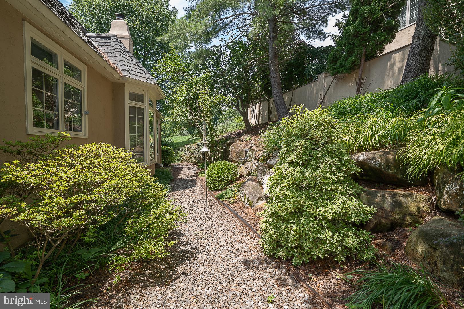 1241 Denbigh Lane Wayne, PA 19087 - Photo 78 of 94 Side elevation and path to meadow
