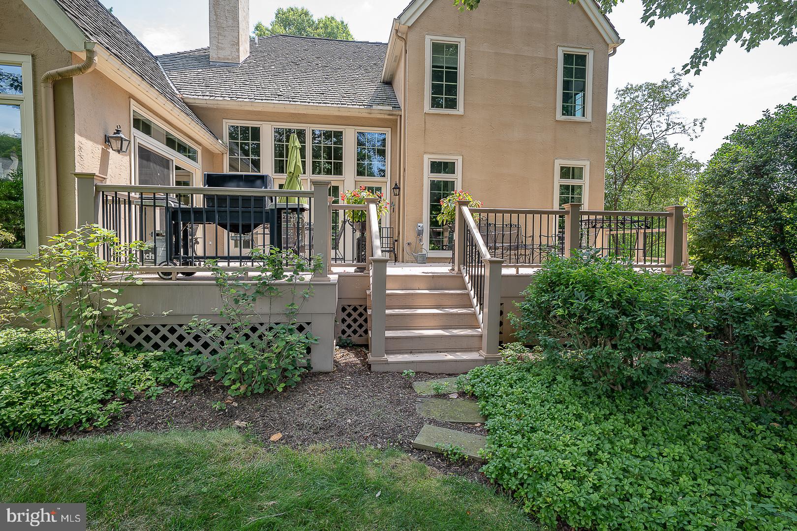 1241 Denbigh Lane Wayne, PA 19087 - Photo 84 of 94 a view of a house with many windows and plants