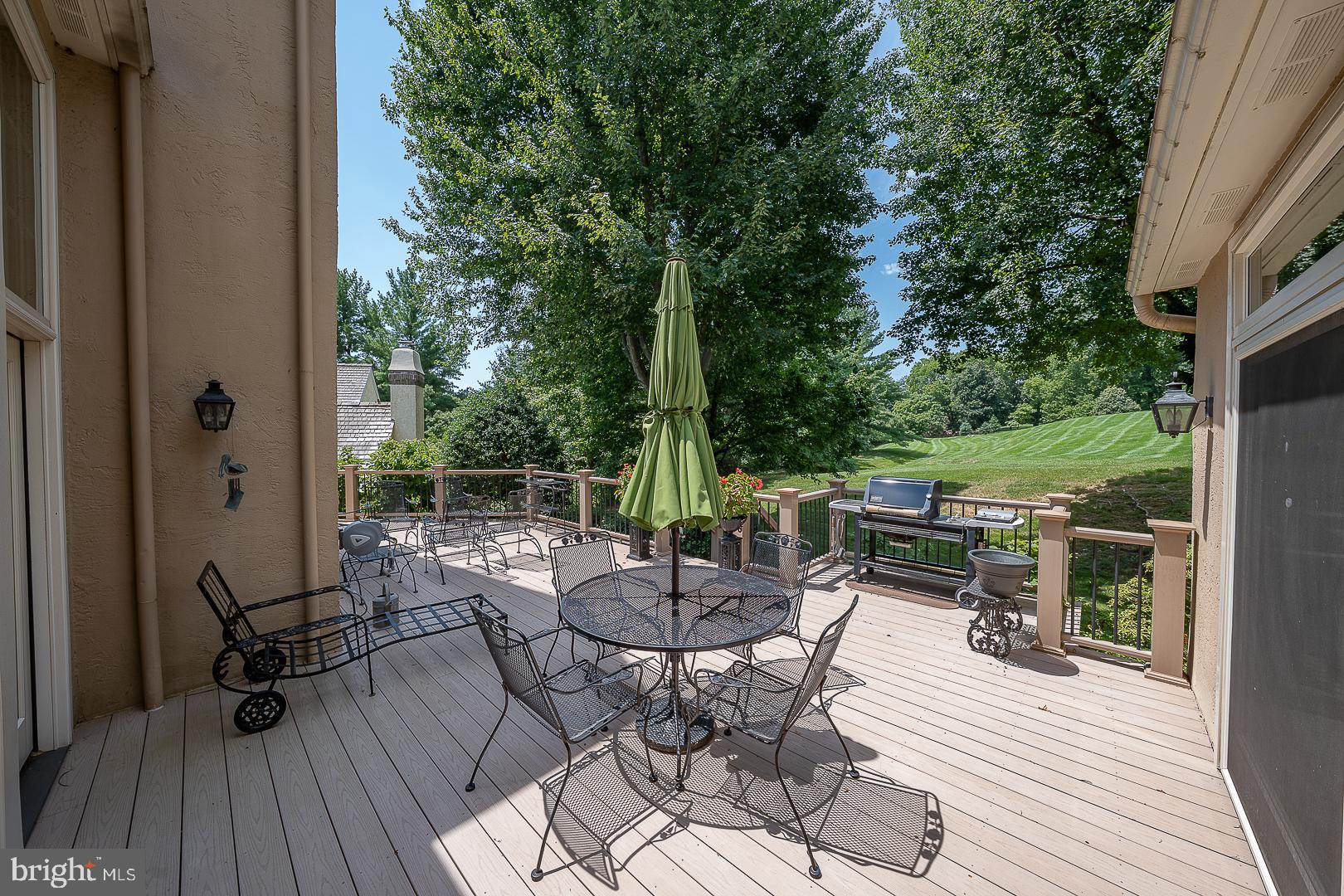 1241 Denbigh Lane Wayne, PA 19087 - Photo 87 of 94 a view of a patio with a dining table and chairs with wooden floor and fence