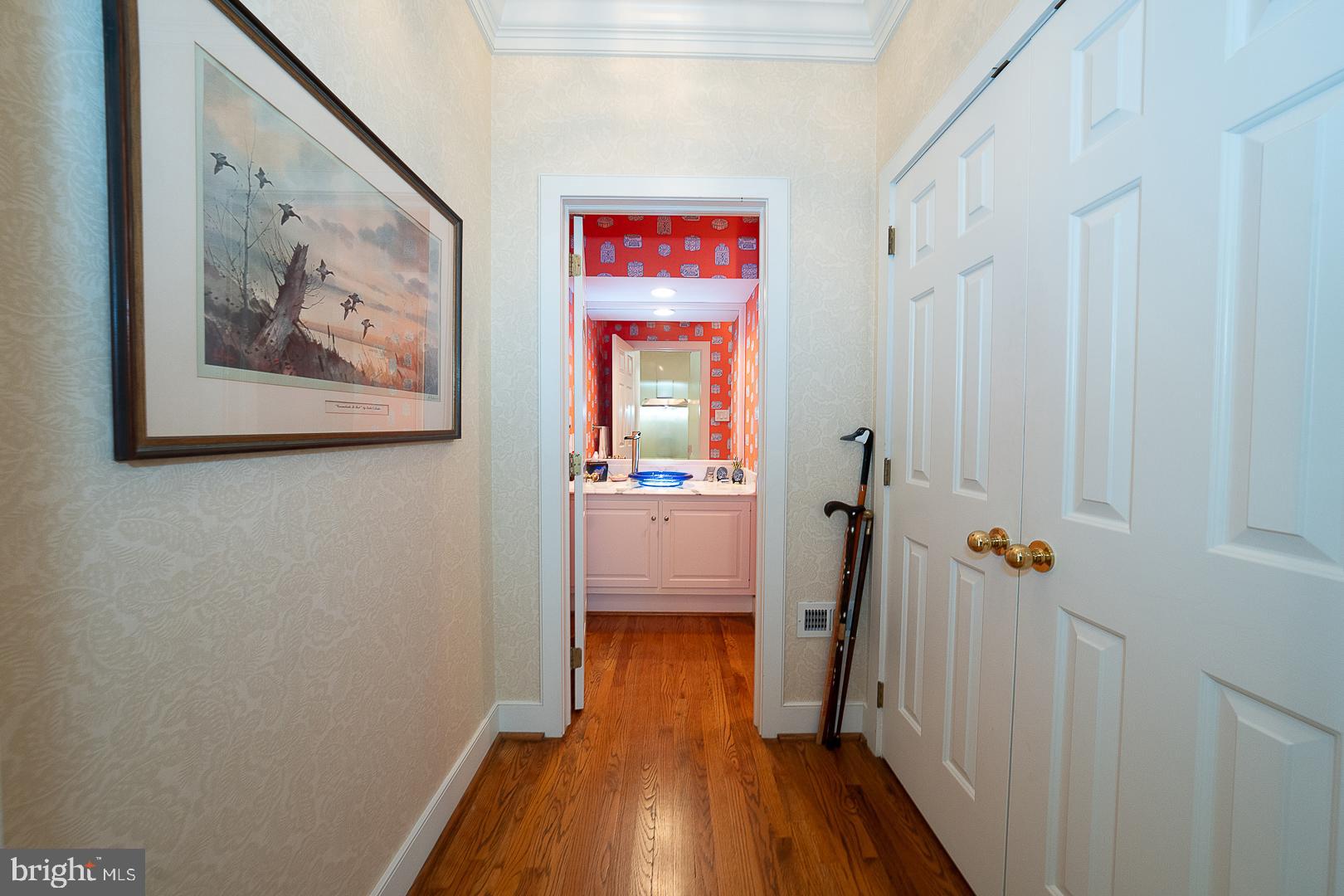 1241 Denbigh Lane Wayne, PA 19087 - Photo 9 of 94 a view of a hallway with wooden floor and closet