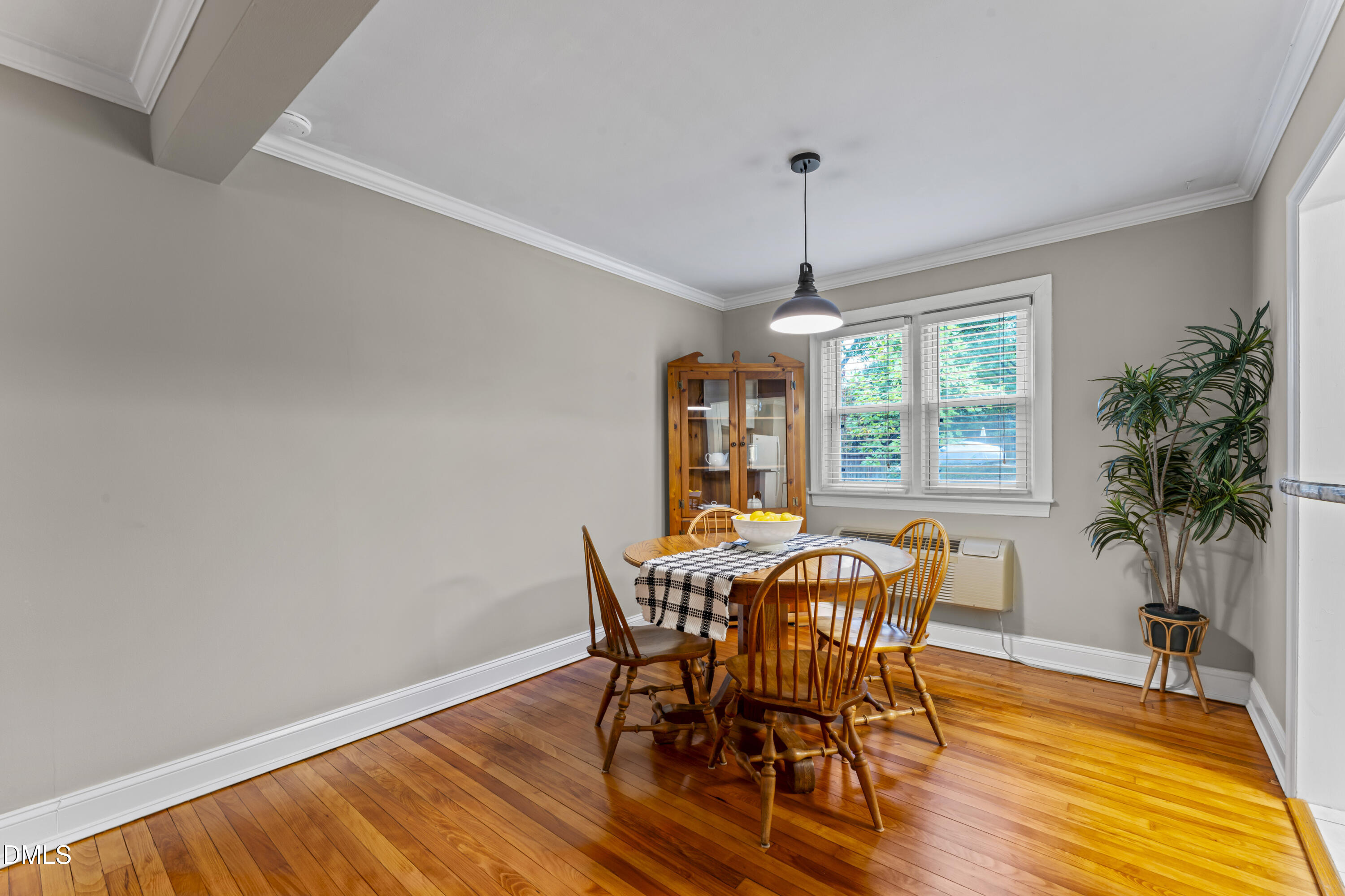 715 Wade Avenue Raleigh, NC 27605 - Photo 11 of 41 a view of a dining room with furniture window and wooden floor