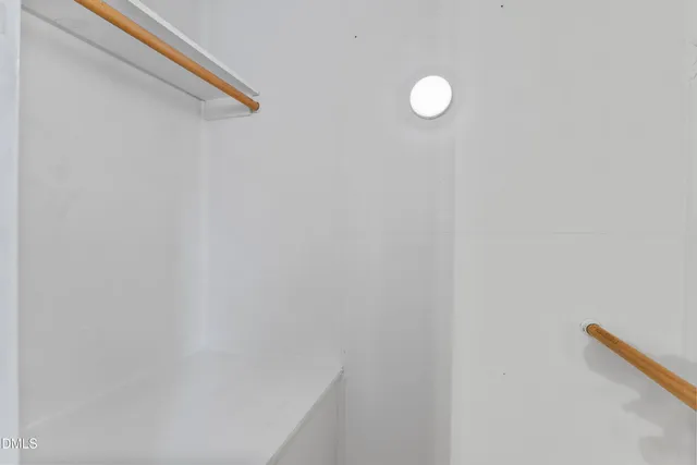 a bathroom with a sink toilet and mirror