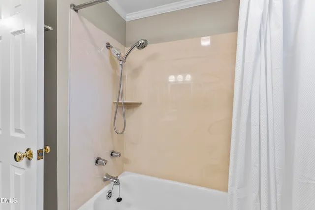 front view of a brick house with a yard