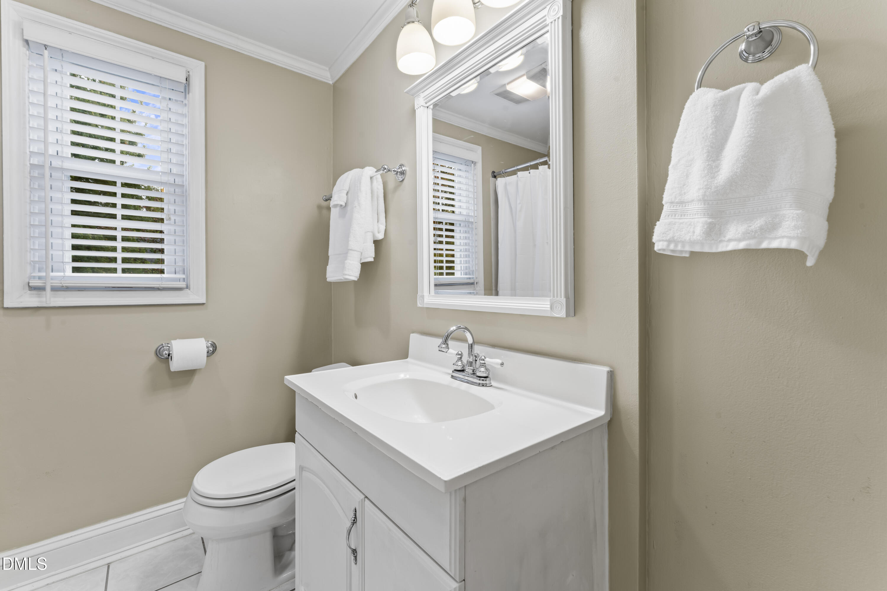 715 Wade Avenue Raleigh, NC 27605 - Photo 26 of 41 a bathroom with a sink toilet and mirror