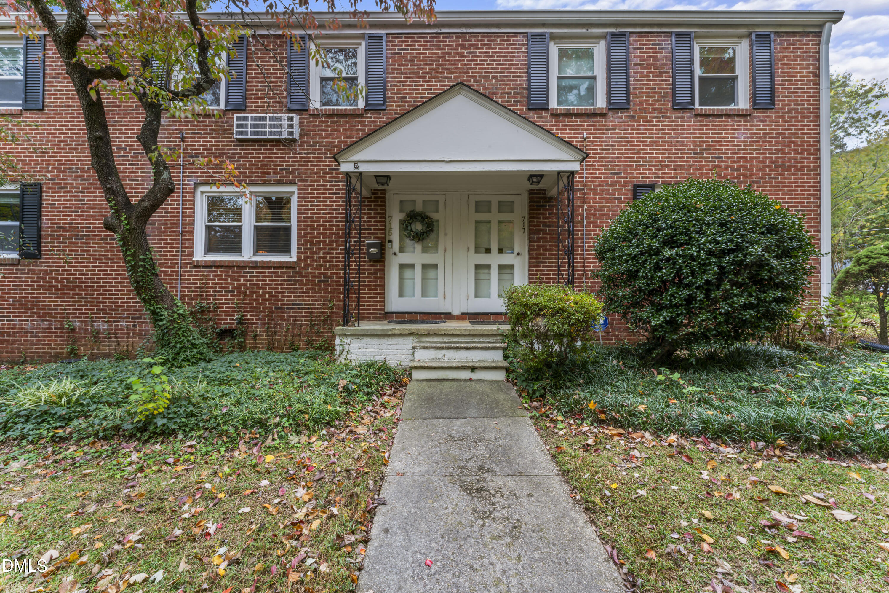 715 Wade Avenue Raleigh, NC 27605 - Photo 29 of 41 front view of a brick house with a yard