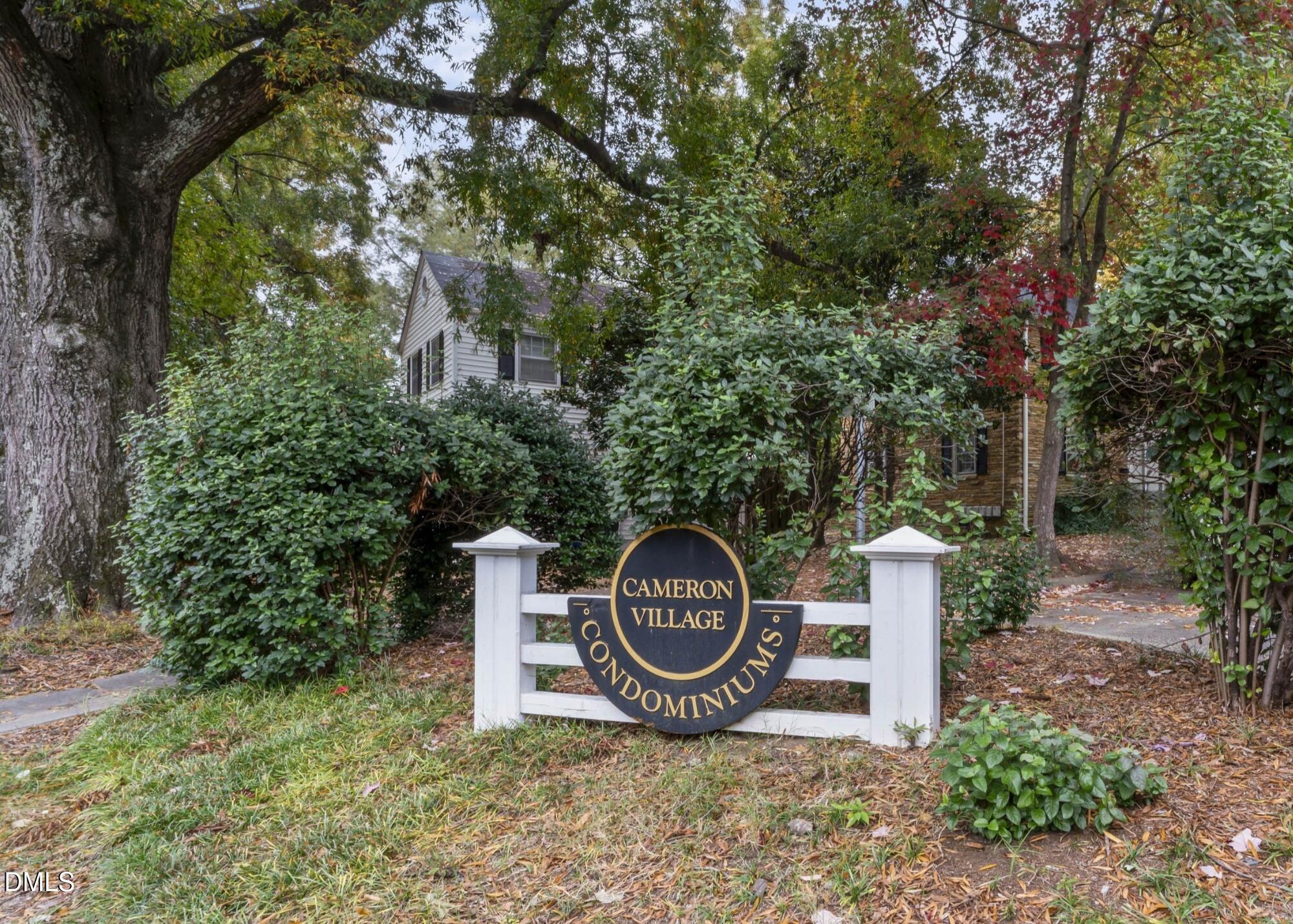 715 Wade Avenue Raleigh, NC 27605 - Photo 35 of 41 a front view of a house with garden space and trees all around