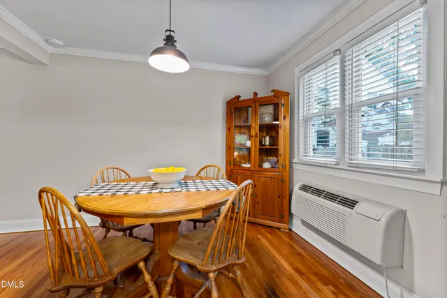 a dining room with furniture and window