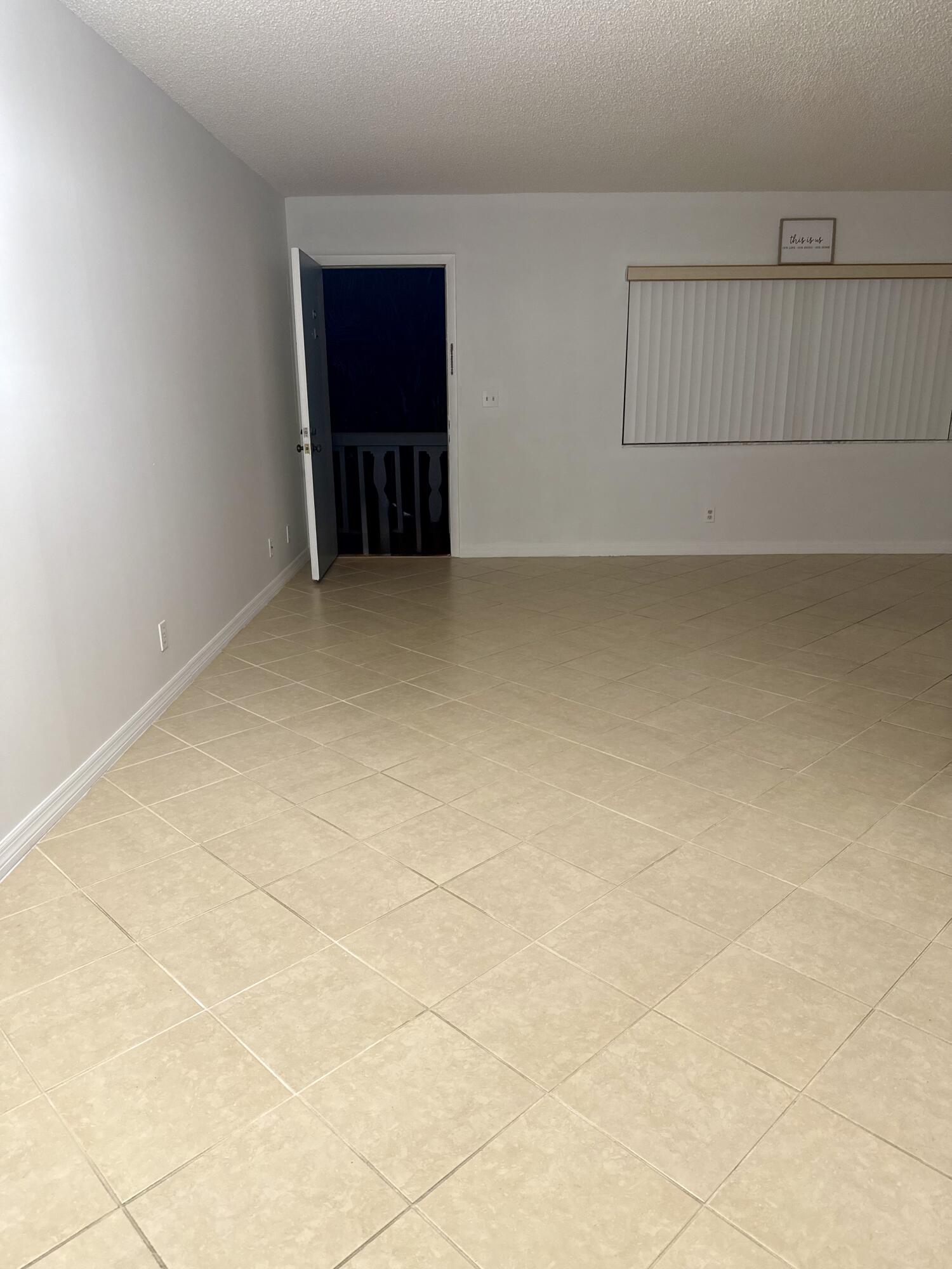 2100 Springdale Boulevard, Unit 306 Palm Springs, FL 33461 - Photo 16 of 19 a view of an empty room