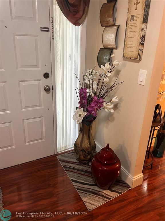3461 Cocoplum Circle, Unit 3431 Coconut Creek, FL 33063 - Photo 1 of 16 a vase of flowers sitting on a table