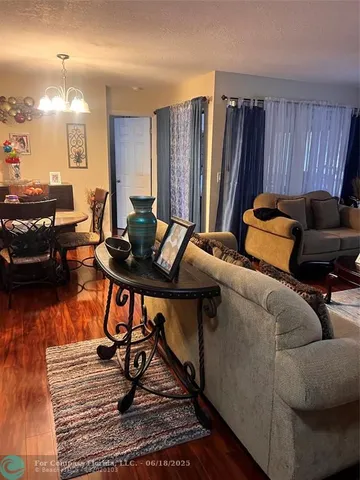 a bedroom with furniture and a wooden floor
