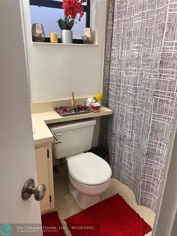 a bathroom with a toilet and a sink