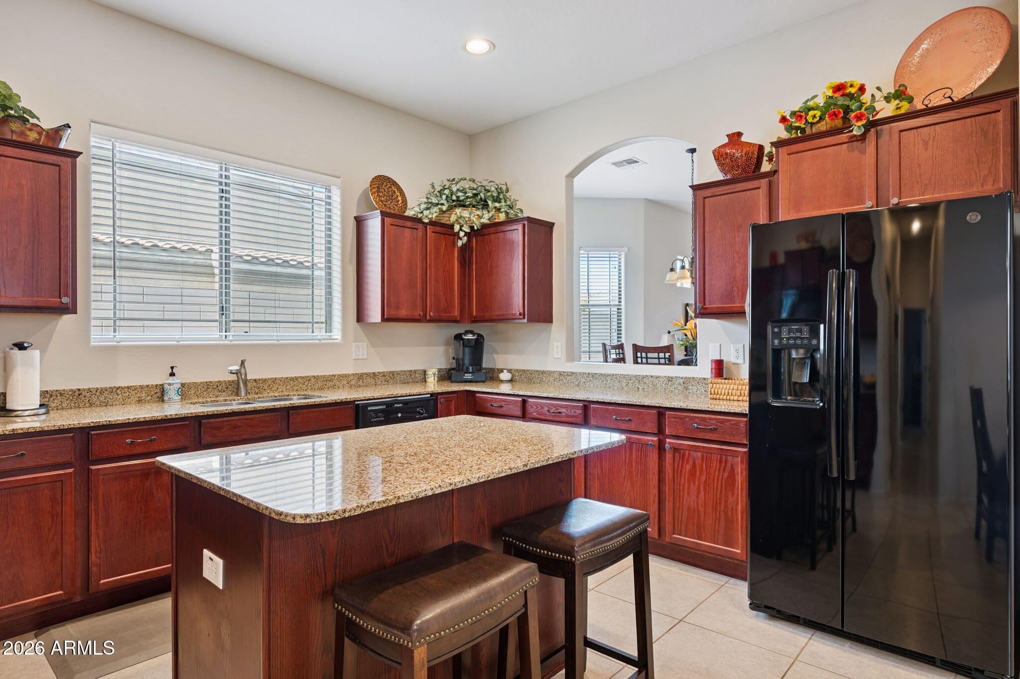 6202 East McKellips Road, Unit 107 Mesa, AZ 85215 - Photo 12 of 32 a kitchen with a sink refrigerator and cabinets