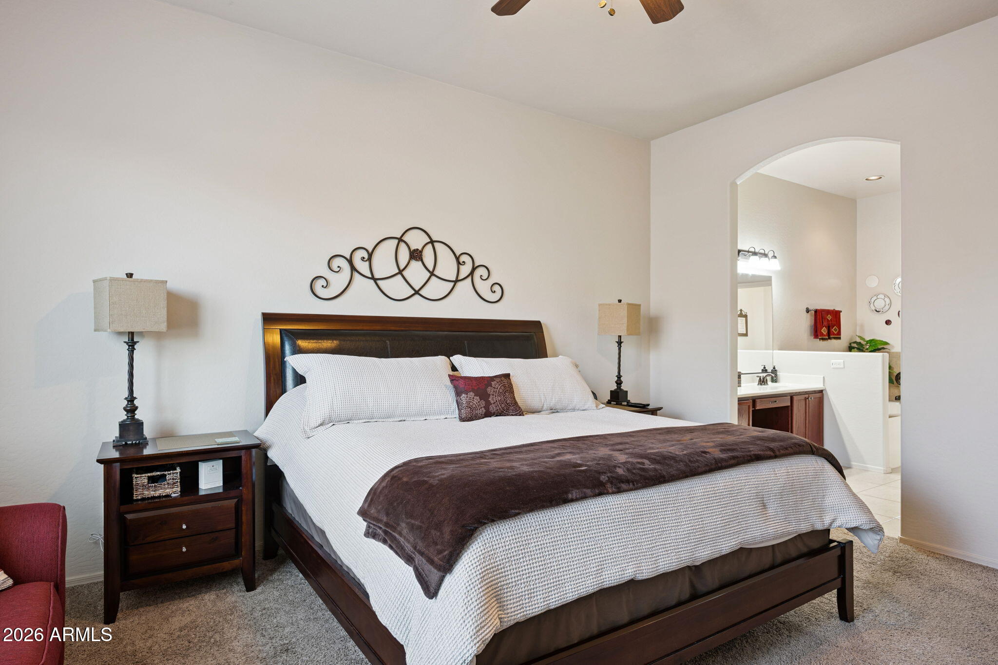 6202 East McKellips Road, Unit 107 Mesa, AZ 85215 - Photo 16 of 32 a bedroom with a bed and dresser