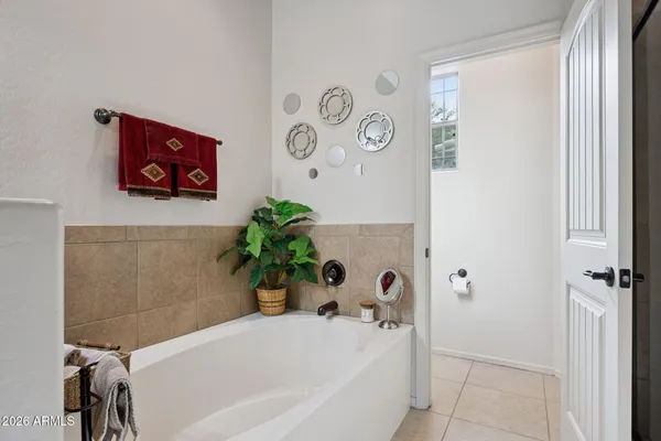 a bathroom with a shower and a glass door