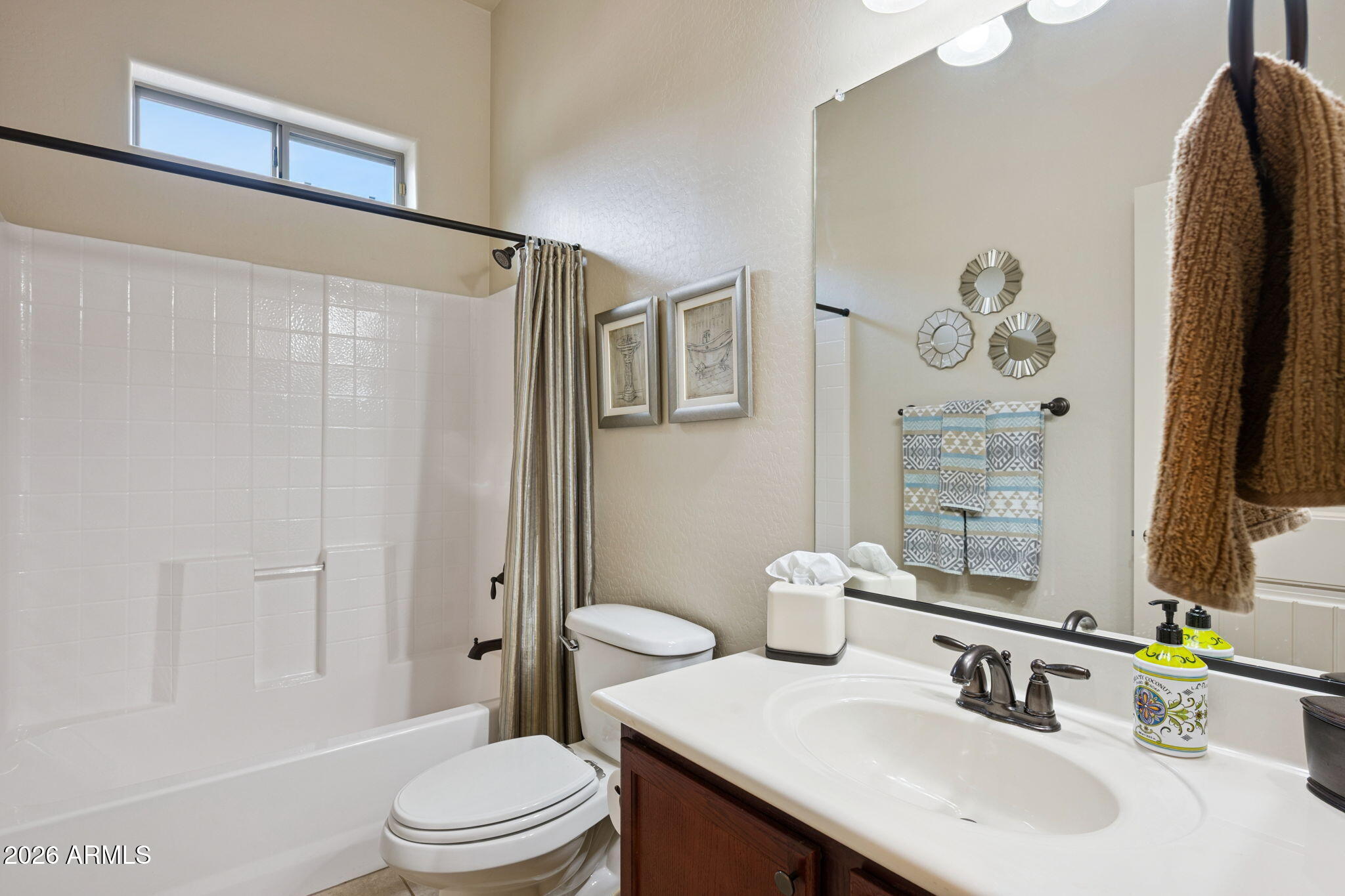 6202 East McKellips Road, Unit 107 Mesa, AZ 85215 - Photo 23 of 32 a bathroom with a sink a toilet and shower