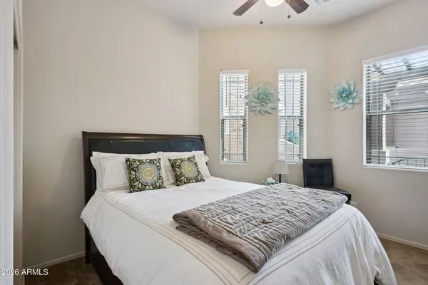 a bedroom with a bed and a cabinets