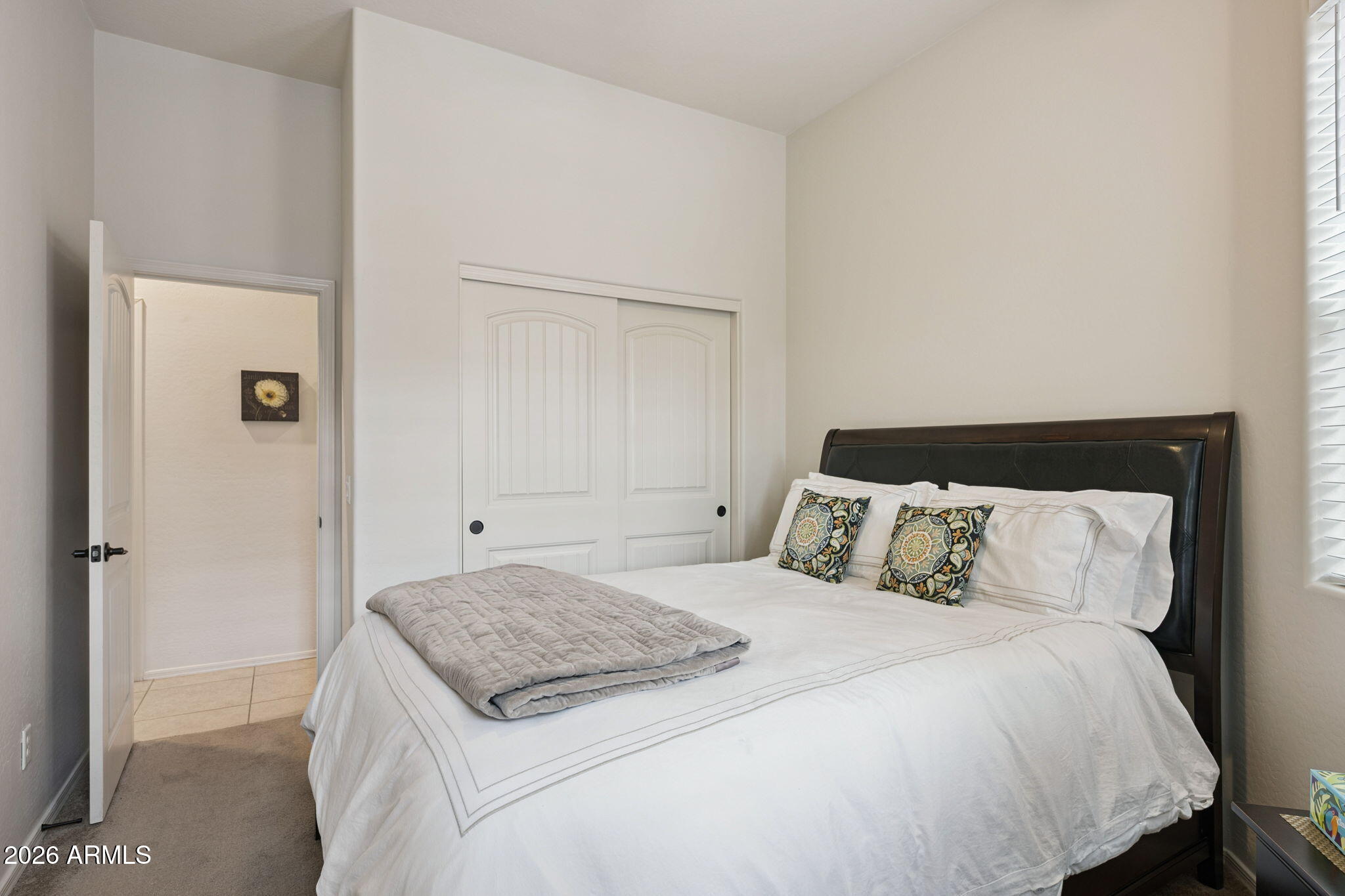 6202 East McKellips Road, Unit 107 Mesa, AZ 85215 - Photo 25 of 32 a bedroom with a bed and a cabinets