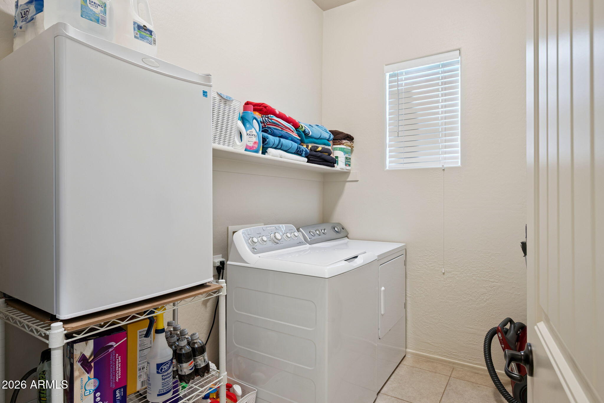 6202 East McKellips Road, Unit 107 Mesa, AZ 85215 - Photo 26 of 32 a utility room with dryer and washer