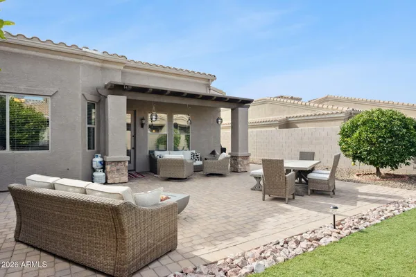 a view of a patio with couches and potted plants