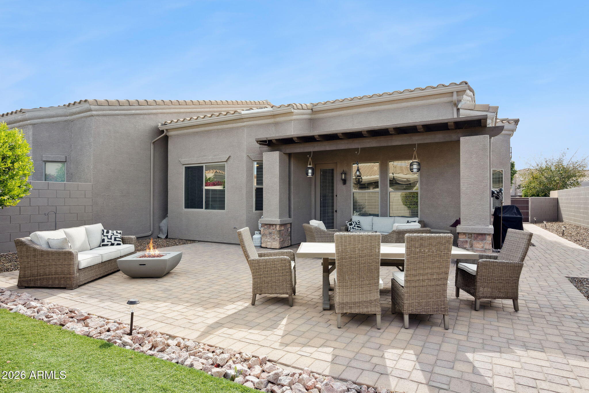 6202 East McKellips Road, Unit 107 Mesa, AZ 85215 - Photo 29 of 32 a view of a patio with couches and potted plants