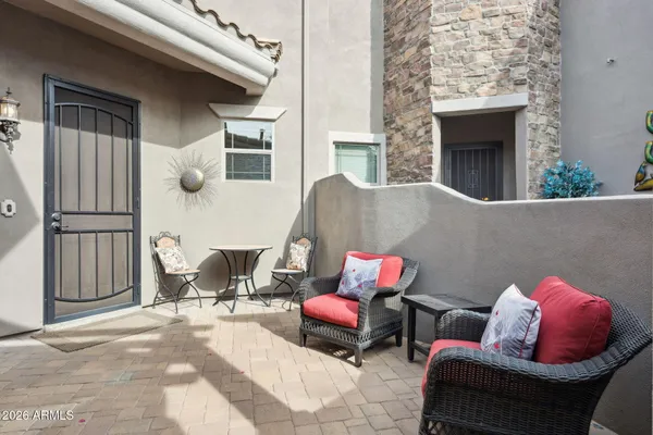 a outdoor living space with furniture and a fireplace