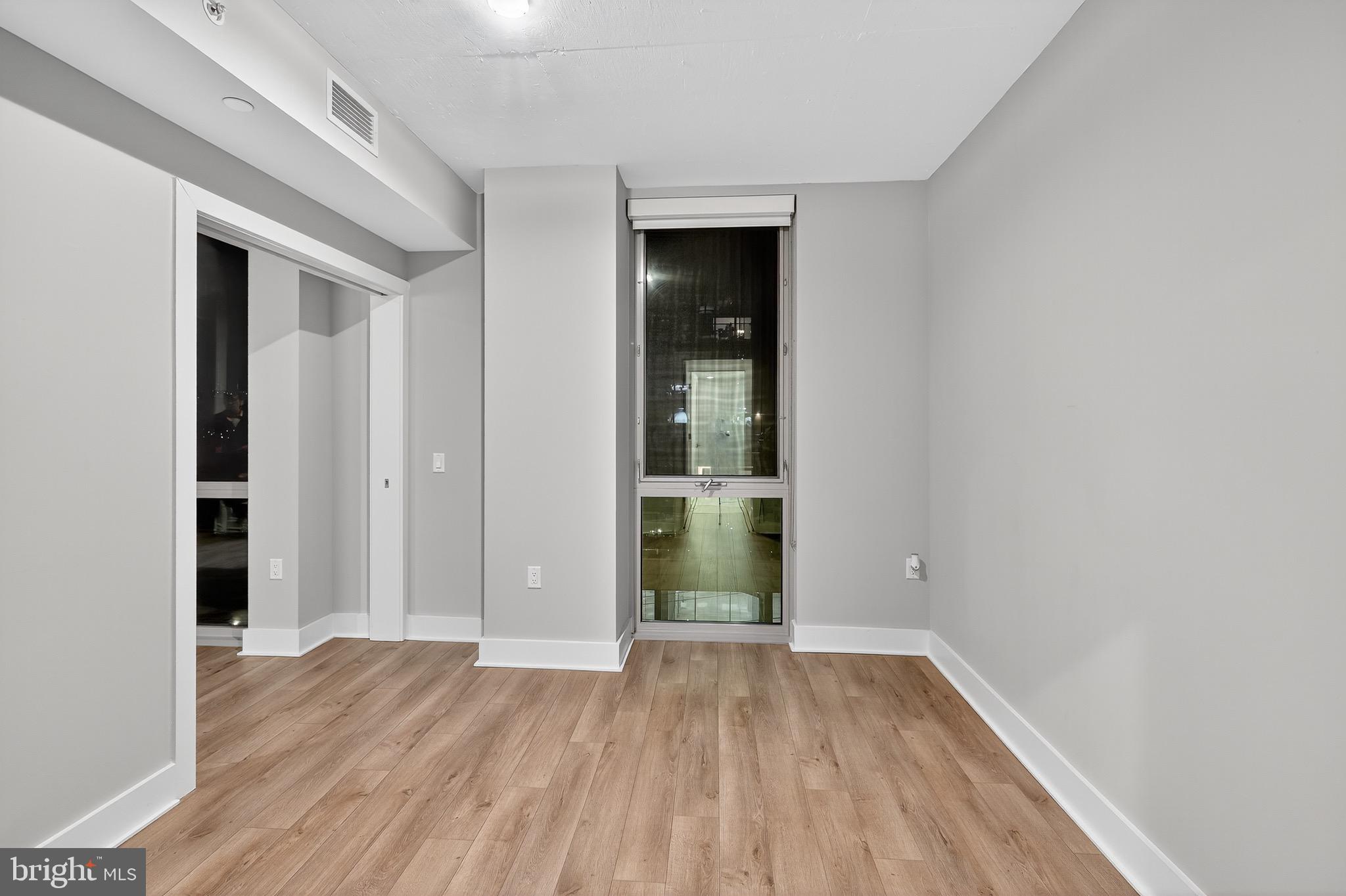 88 V Street Southwest, Unit 509 Washington, DC 20024 - Photo 17 of 36 wooden floor in an empty room