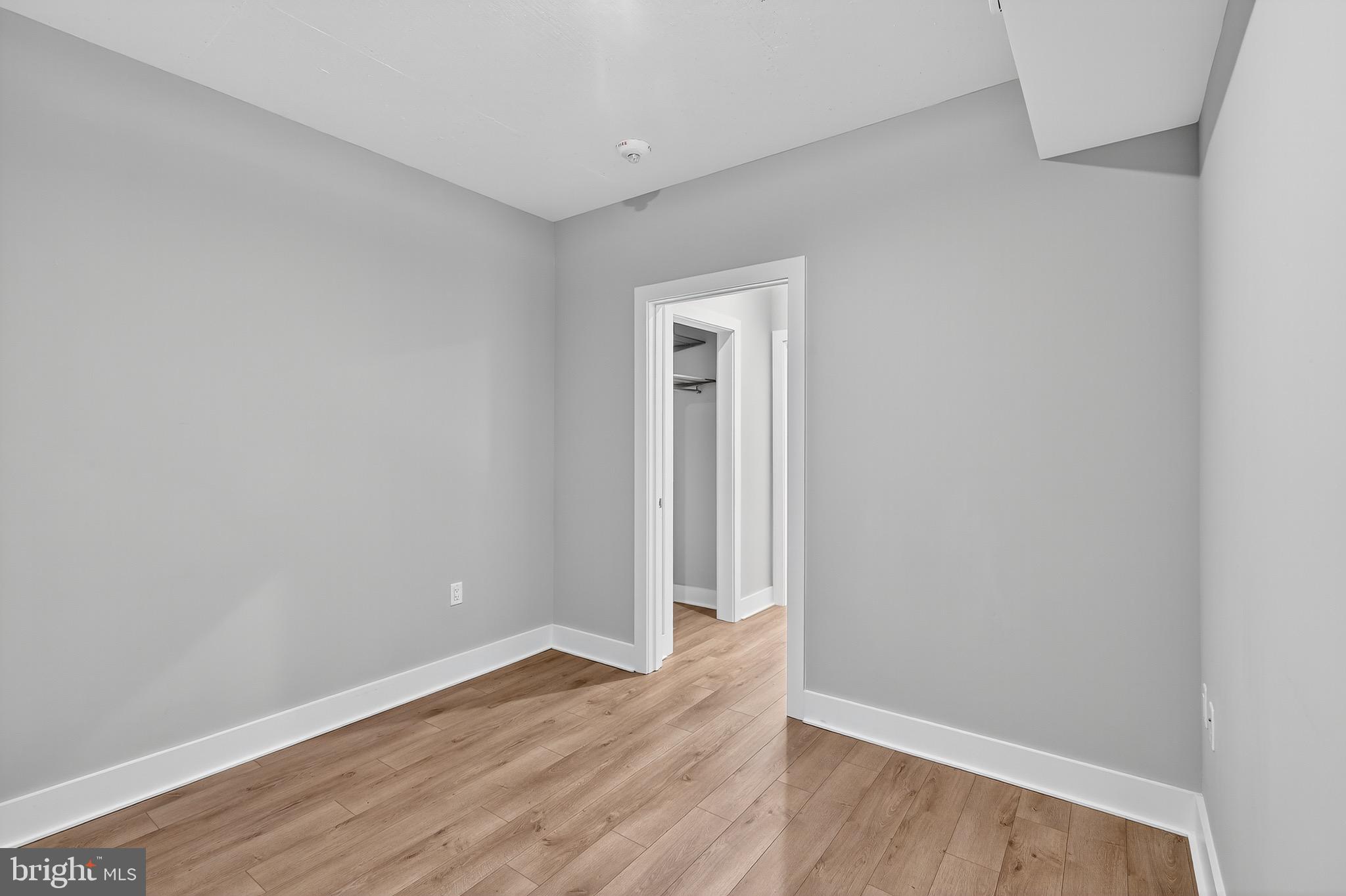 88 V Street Southwest, Unit 509 Washington, DC 20024 - Photo 24 of 36 a view of an empty room with wooden floor