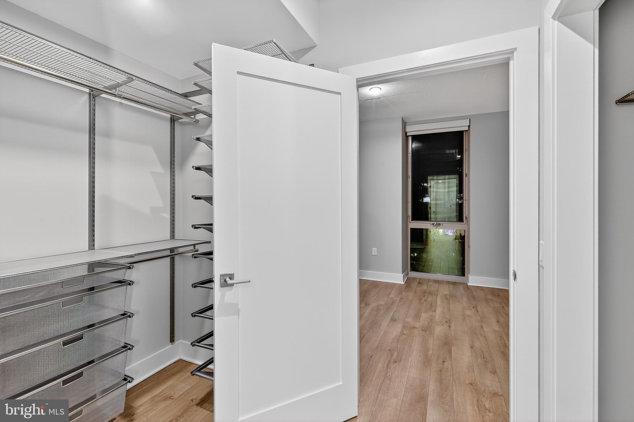 88 V Street Southwest, Unit 509 Washington, DC 20024 - Photo 28 of 36 a view of walk in closet with empty racks