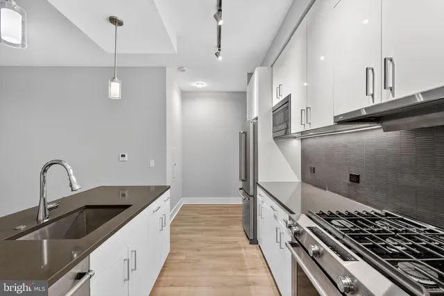 a kitchen with sink and stove