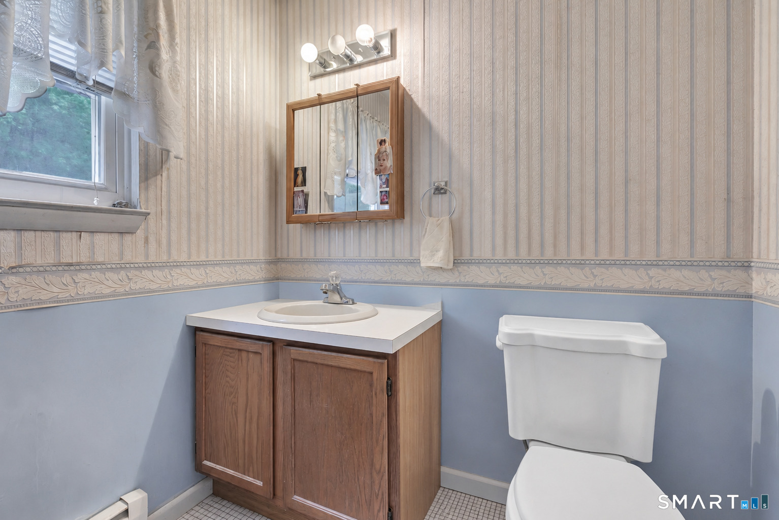 123 River Road Shelton, CT 06484 - Photo 13 of 27 a bathroom with a toilet a sink and mirror