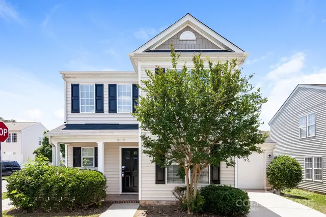 a front view of a house with yard