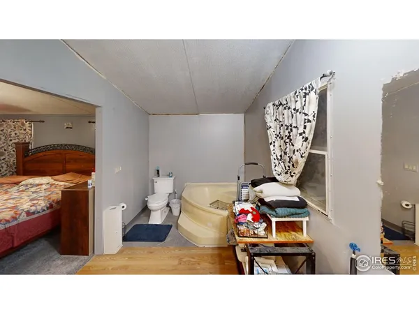 a open kitchen with a sink and refrigerator