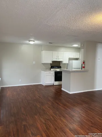 a view of kitchen with wooden floor
